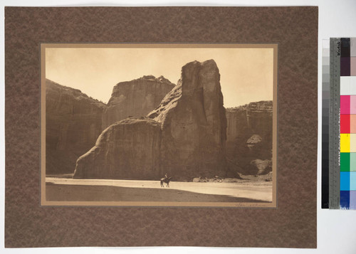 Canyon walls and distant view of cliff-dwelling, Canyon de Chelly, Arizona