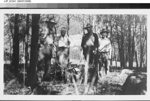 Hunters pose with dead elk