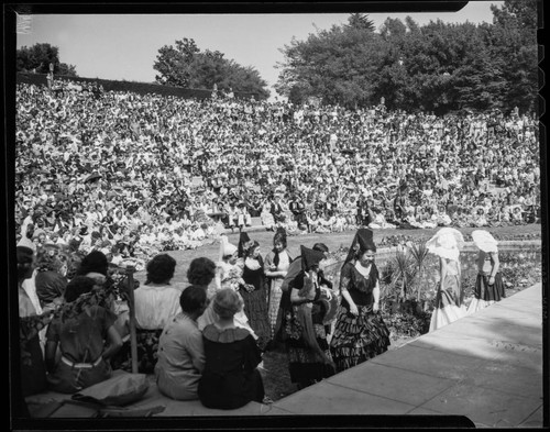 Audience and costumed players at the amphitheater at Santa Monica High School Fiesta