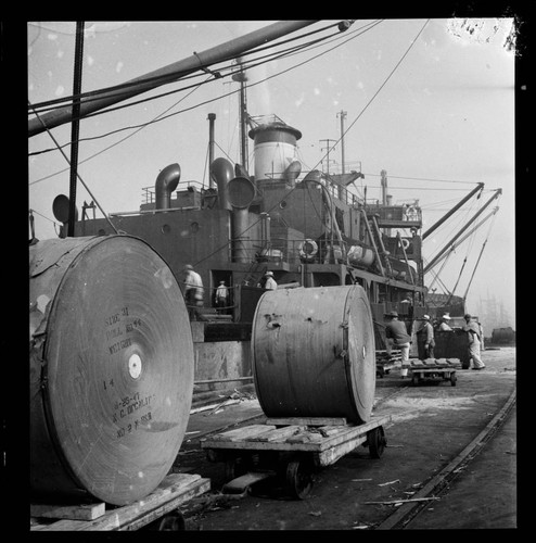 Rolls of newsprint unloaded at the dock, Port of Los Angeles