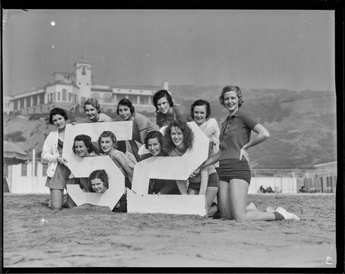 Group of women with number 52 sign at the Bel-Air Bay club, Santa Monica