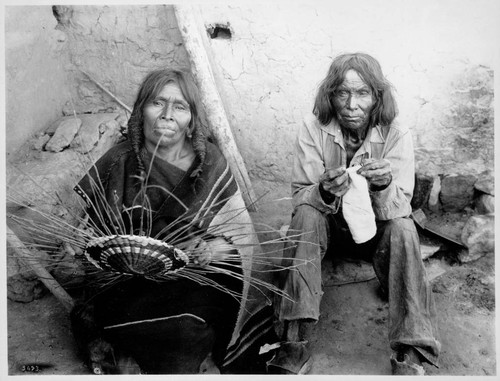 Hopi woman making basket and man crocheting