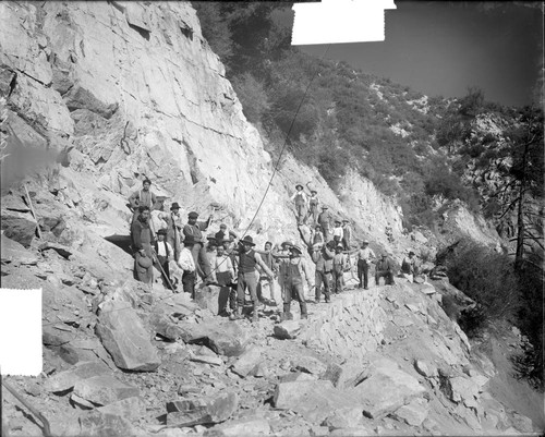 Asian construction workers widening the toll road on Mount Wilson