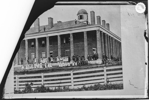 Young girls, boys and teachers outside Young Ladies Seminary for the Cherokee Nation