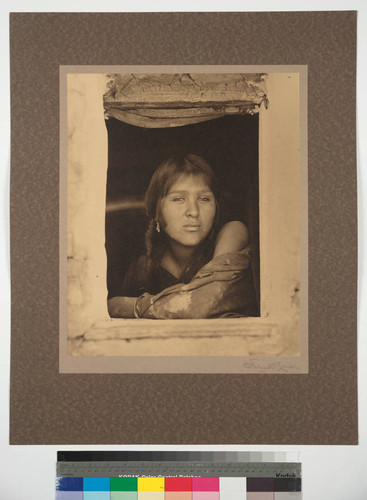 Masecalli at window. Hopi belle of the village of Oraibi, Arizona