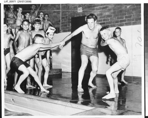 Dad pulled into the water at the dedication of Harry Chandler Memorial Pool