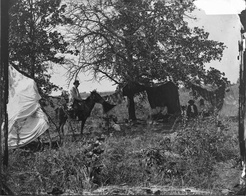 Cheyenne Chief Whirlwind and wife with Phil Block [Black?] and wife, and Philip McClusker, interpreter, on horseback