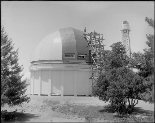 Painters on scaffolding on the 60-inch telescope dome, Mount Wilson Observatory