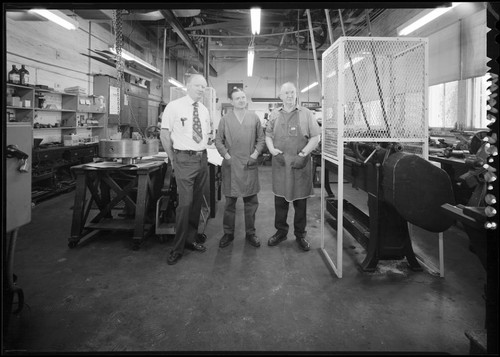 Rudolf Ribbens, Stephen Doro, and Fred O'Neil inside Mount Wilson Observatory's machine shop, Pasadena