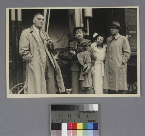 Edwin Powell Hubble, Grace Burke Hubble and an unidentified couple standing in front of a train