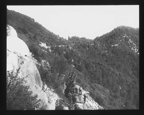 Tube of the 60-inch telescope being transported along a mountain road on Mount Wilson