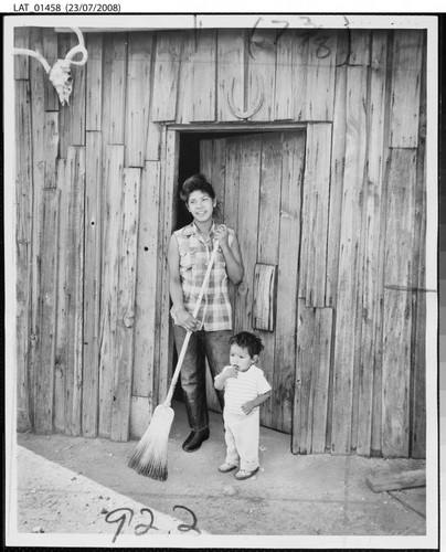 Frances Hinio and her son standing in front of their home at Tejon Ranch