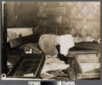 Interior room with overturned furniture and bedclothes, Old Chinatown, Los Angeles