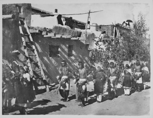 Fiesta de San Esteban. Religious dancers before the Kiva. Acoma