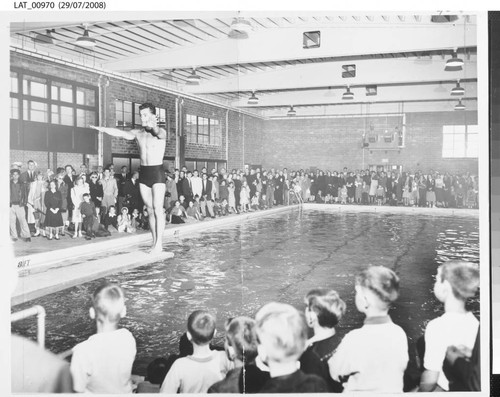 Diver performs during dedication of Harry Chandler Memorial Pool