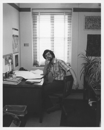 Armando Manduca, sitting at his office desk