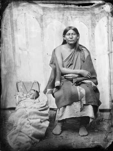 Hle-ah-toe-me. Osage mother with babe in cradle. Her husband was killed at Medicine Lodge