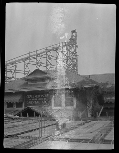 Construction of Treasure House, being built around old house at 46 N. Los Robles, Pasadena