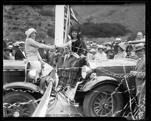 Women representing Canada and Mexico shaking hands at the Roosevelt Highway Dedication, Sycamore Canyon, Malibu