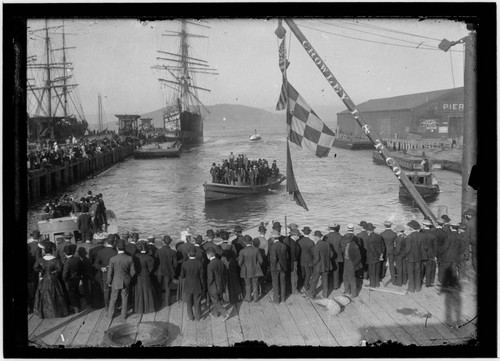 Crowd and boats at pier, Coos Bay, Oregon