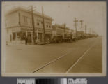 Los Angeles street corner with men in front of Arlington Pharmacy