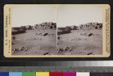 View of a Hopi pueblo, with kiva in foreground