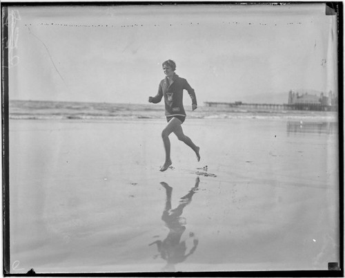 Lily May Bowmer jogging on the beach near Santa Monica Pier, California