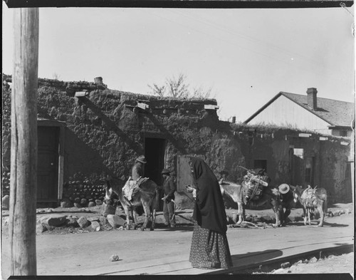 Santa Fe street scene, men with donkeys