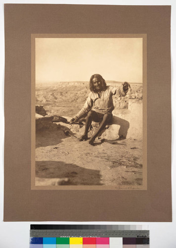 Hopi Indian of Oraibi, Arizona. Making yarn for Hopi ceremonial dress