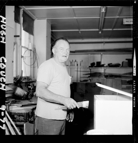 Hugh Couch, with paintbrush in hand, in the Mount Wilson Observatory's Pasadena shop