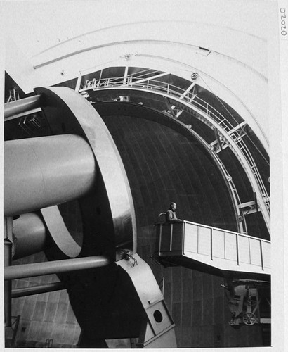 An observer riding the elevator to the 200-inch telescope, Palomar Observatory