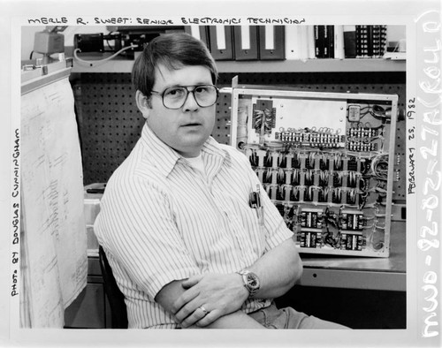 Merle R. Sweet at his desk