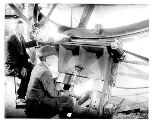 Two men cutting the teeth in the worm wheel of the Hooker Telescope, Mount Wilson Observatory