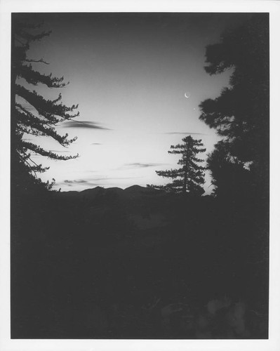 Crescent moon and a bright planet seen in the sky, sunset, Mount Wilson