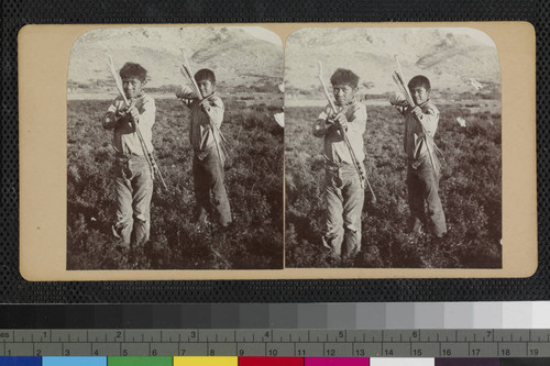 Hualapai Indian boys with bow and arrows