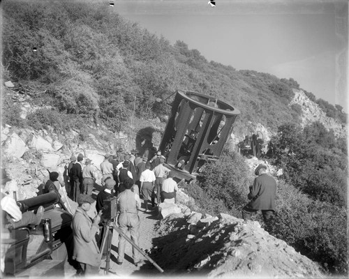 Lower section of 100-inch telescope tube on Observatory truck; trailer slightly off the road