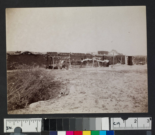 Adobe structures in unidentified pueblo or settlement