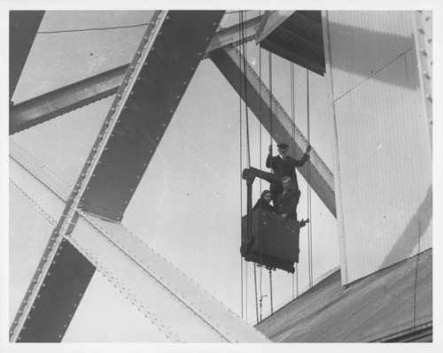 Ferdinand Ellerman and two passengers riding the bucket to the top of the 150-foot tower, Mount Wilson Observatory