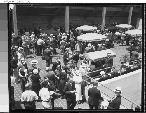 Guests mingling at Harry Chandler's 70th birthday party