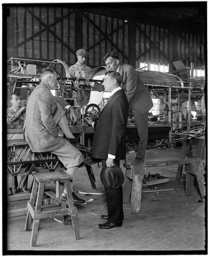 Curtis D. Wilbur and Donald Douglas talking to workers at Douglas Company factory, Santa Monica, California