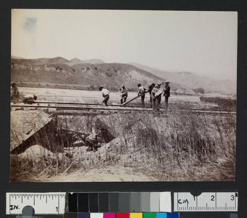 Men working on railroad tracks