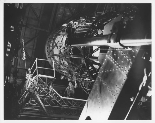 Edwin P. Hubble seated on the elevating platform at the Hooker 100-inch reflecting telescope