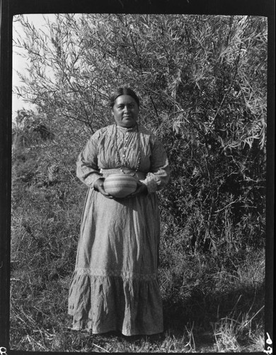 Mary Benson holding "shuwitgie" basket