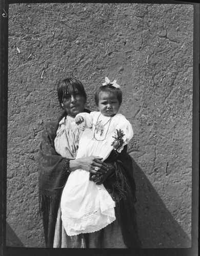 Mrs. John Concha and baby at their ranch, Taos