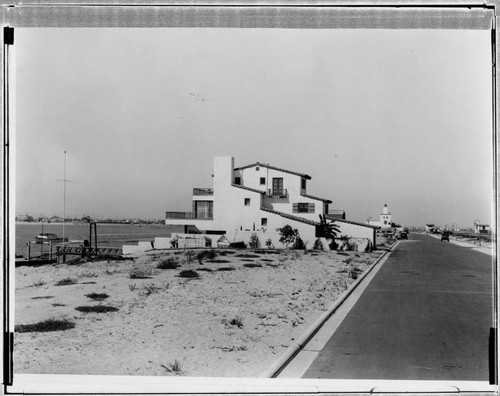 Lido Isle road, buildings, and beach, Newport Beach. approximately 1930