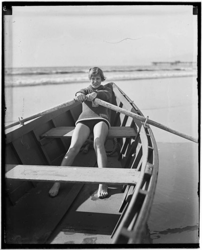 Lily May Bowmer rowing a boat near Santa Monica Pier, California