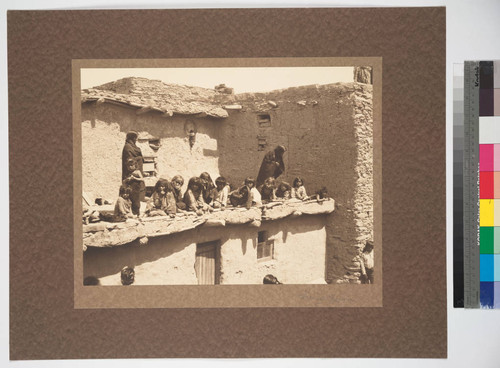 Hopi women and children in pueblo of Oraibi, 1890