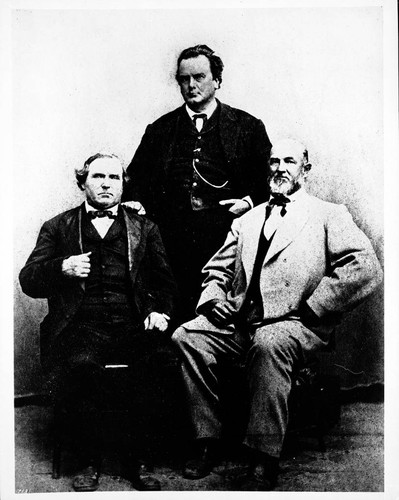 General Phineas Banning (standing), Matthew Keller (left) and John H. Hollister (right)