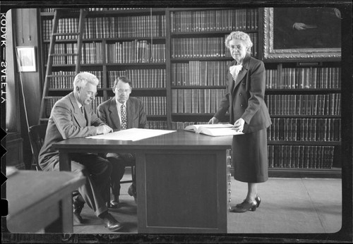 Seth Nicholson, Paul Merrill and Elizabeth Connor posed in the Mount Wilson Observatory Library, Pasadena