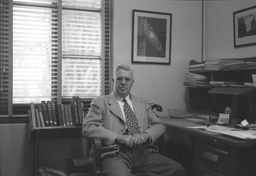 Milton L. Humason, seated at his desk, Mount Wilson Observatory